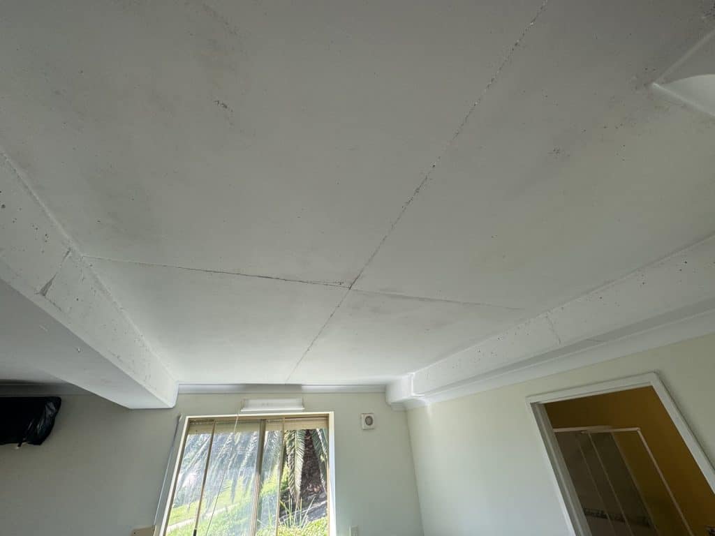 white ceiling with light coming through a window